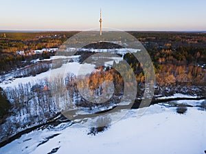 Pirita Kose area of Tallinn with beautiful nature and river on a winter day. In the background is the TV tower. Drone photo photo